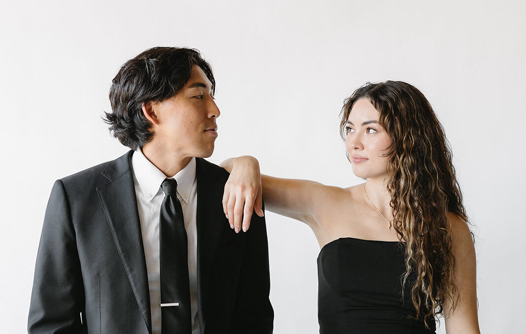 Bride and groom posing in modern photo booth at Southern California wedding reception